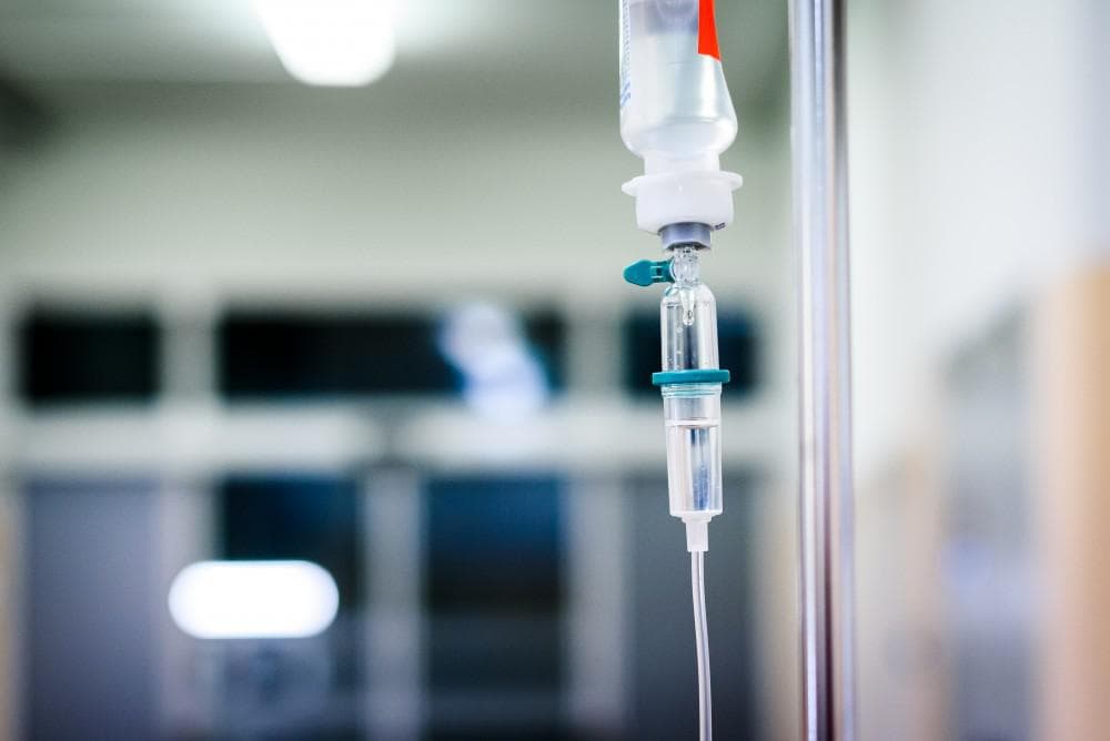A close up of an iv drip in a room