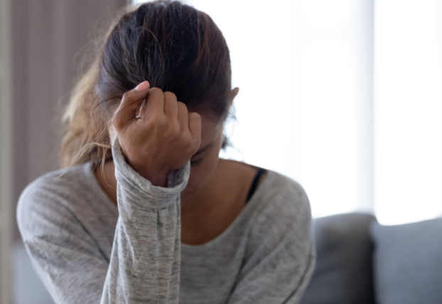 A woman sitting in stress