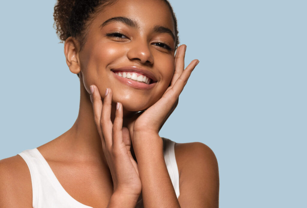 A woman with her hands on her face.