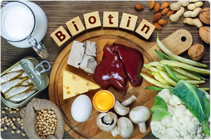 A wooden table topped with healthy food