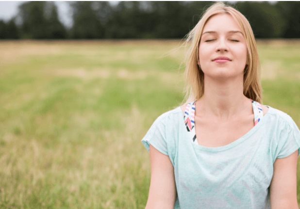 closeup shot of a woman practicing meditation